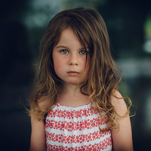 young girl looking very sad