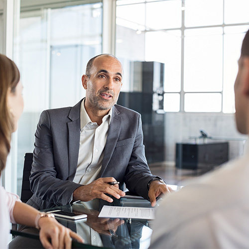 Couple meeting with local attorney for legal advice. 