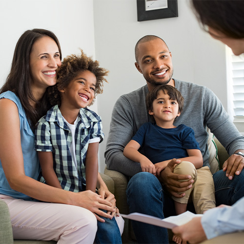 Parents and their kids meeting with a counselor